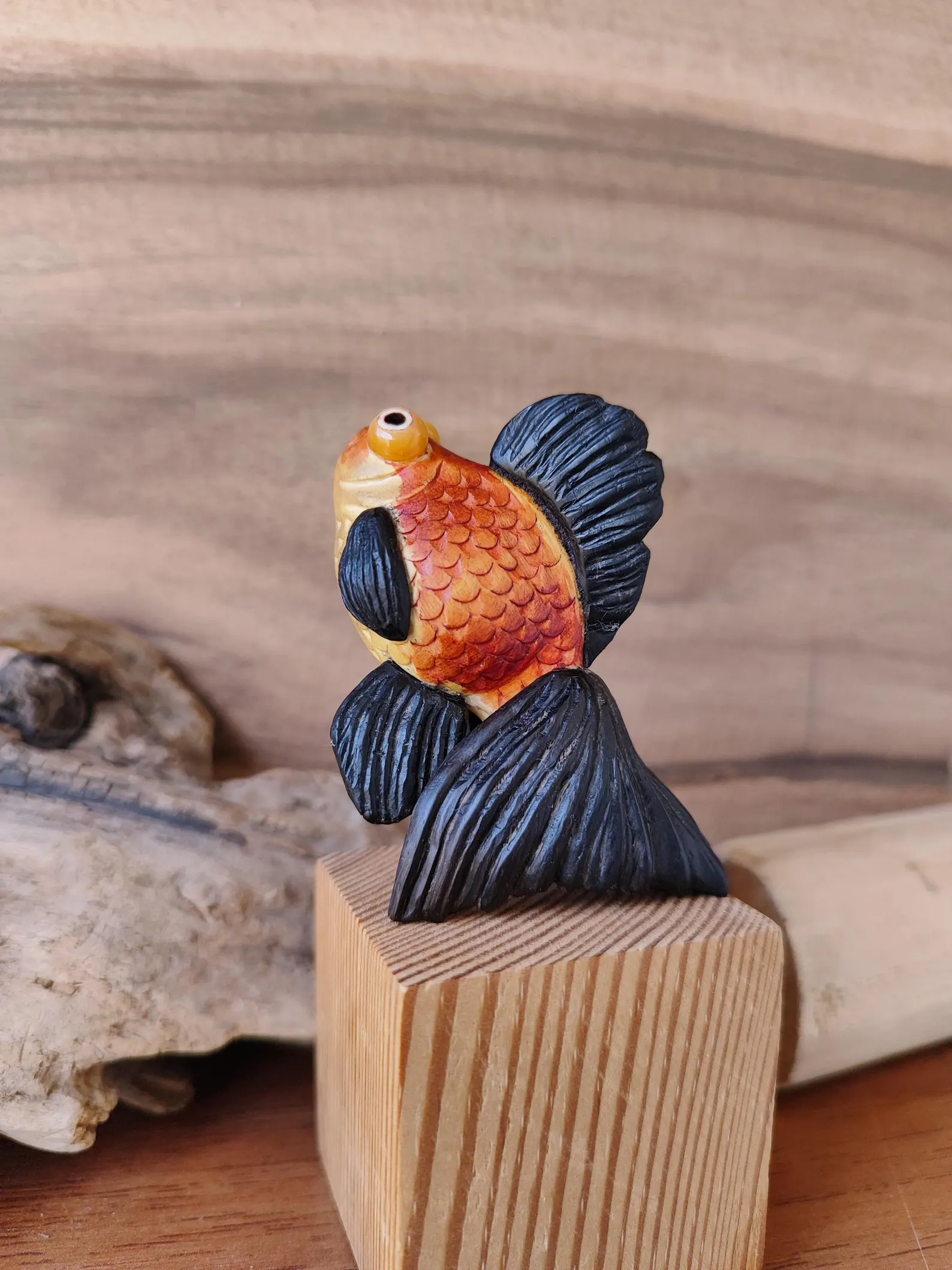 Telescope goldfish figurine